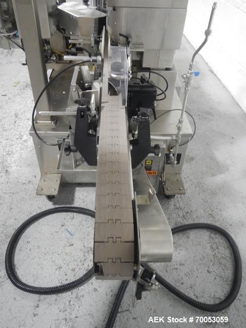 Used-Used New Jersey wrap around labeler, model 334RSTP, speeds up to 400 units/minute, trunion roll bottle handling system,...