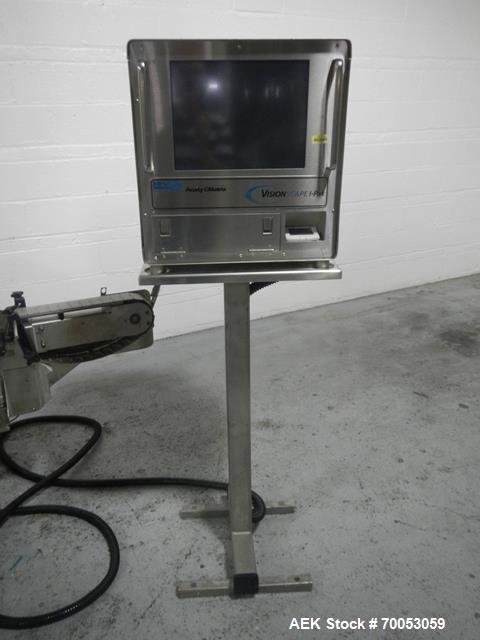 Used Used New Jersey wrap around labeler, model 334RSTP, speeds up to 400 units/minute, trunion roll bottle handling system, Open Date coder, model Printmaster R/H, size range of 1" -14" container he...