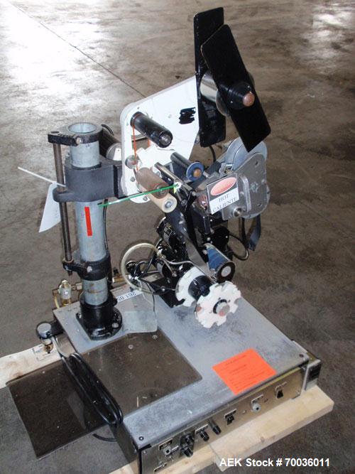 Used Avery 6101 Pressure Sensitive Spot or Wraparound Labeler, Model 6101-3-RH. Bench or tabletop labeler design, has hot stamp date coder, star wheel bottle indexing and 4" label web. Serial #402153...