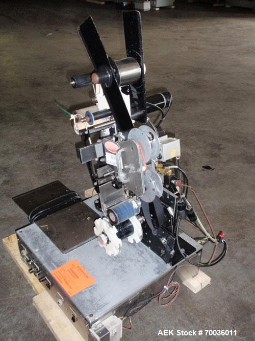 Used Avery 6101 Pressure Sensitive Spot or Wraparound Labeler, Model 6101-3-RH. Bench or tabletop labeler design, has hot stamp date coder, star wheel bottle indexing and 4" label web. Serial #402153...