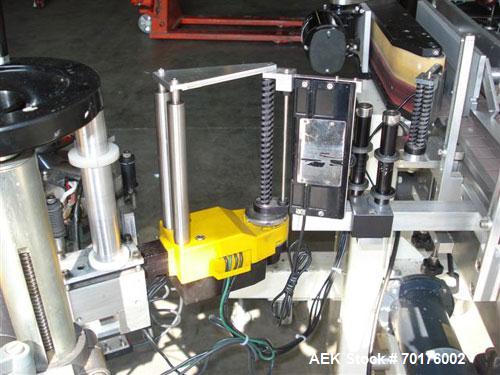 Used CCL Collomat Wrap Around Pressure Sensitive Labeler, model 6600. Can handle a label up to 6.75" high, currently set to run 3.25" high labels. 136.5" long x 4.5" wide conveyor, table top chain be...