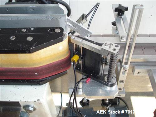 Used CCL Collomat Wrap Around Pressure Sensitive Labeler, model 6600. Can handle a label up to 6.75" high, currently set to run 3.25" high labels. 136.5" long x 4.5" wide conveyor, table top chain be...