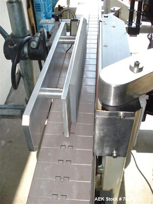 Used CCL Collomat Wrap Around Pressure Sensitive Labeler, model 6600. Can handle a label up to 6.75" high, currently set to run 3.25" high labels. 136.5" long x 4.5" wide conveyor, table top chain be...