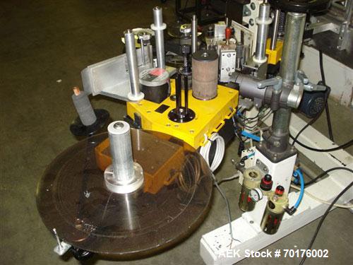 Used CCL Collomat Wrap Around Pressure Sensitive Labeler, model 6600. Can handle a label up to 6.75" high, currently set to run 3.25" high labels. 136.5" long x 4.5" wide conveyor, table top chain be...