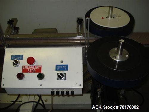 Used CCL Collomat Wrap Around Pressure Sensitive Labeler, model 6600. Can handle a label up to 6.75" high, currently set to run 3.25" high labels. 136.5" long x 4.5" wide conveyor, table top chain be...