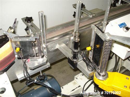 Used CCL Collomat Wrap Around Pressure Sensitive Labeler, model 6600. Can handle a label up to 6.75" high, currently set to run 3.25" high labels. 136.5" long x 4.5" wide conveyor, table top chain be...
