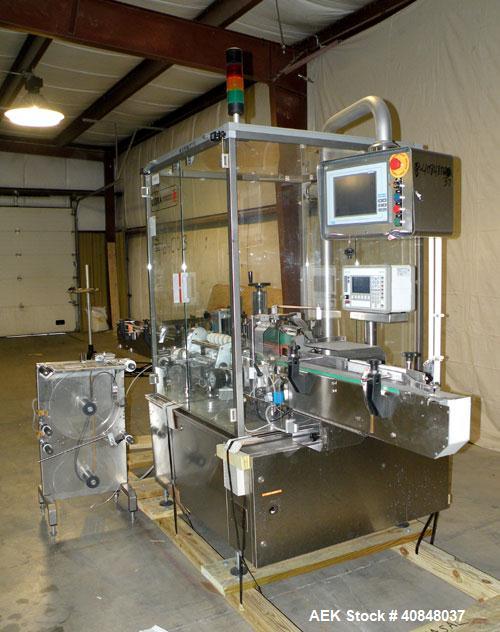 Used Libra Pharmaceutical Technologies Pressure Sensitive Bottle Labeler, Model SENS 350. Designed to apply pressure sensitive labels on cylindrical containers of metal, glass, or plastic. Maximum ou...