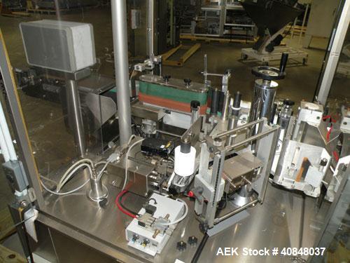 Used Libra Pharmaceutical Technologies Pressure Sensitive Bottle Labeler, Model SENS 350. Designed to apply pressure sensitive labels on cylindrical containers of metal, glass, or plastic. Maximum ou...