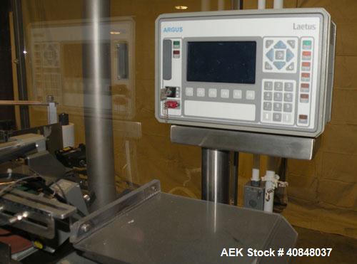 Used Libra Pharmaceutical Technologies Pressure Sensitive Bottle Labeler, Model SENS 350. Designed to apply pressure sensitive labels on cylindrical containers of metal, glass, or plastic. Maximum ou...