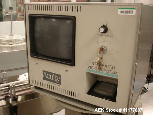 Used Kalish Labelstar Wraparound Pressure Sensitve Labeler, Model LS4000. Capable of speeds up to 150 cpm. Unit has Acuity PMC80 vision system, open date hot stamp coder bump wheel indexing, top hold...