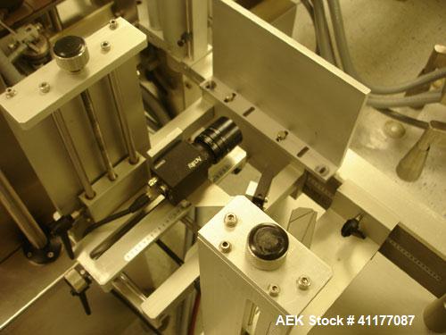 Used Kalish Labelstar Wraparound Pressure Sensitve Labeler, Model LS4000. Capable of speeds up to 150 cpm. Unit has Acuity PMC80 vision system, open date hot stamp coder bump wheel indexing, top hold...