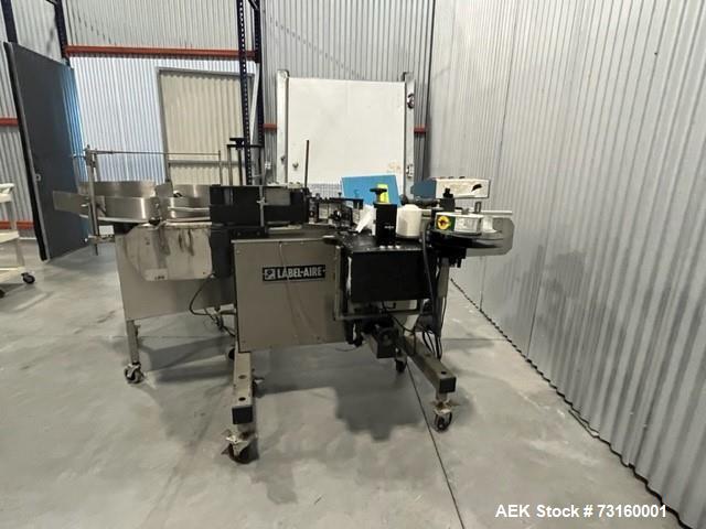 Label Aire pressure sensitive wraparound labeler.