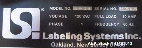 Used Labeling Systems Inc (LSI) Semi Automatic Wrap Around Labeler, Model 301S. Designed for semi automatic wrap around labeling of products such as bottles, vials or cans. Maximum bottle size 12" hi...