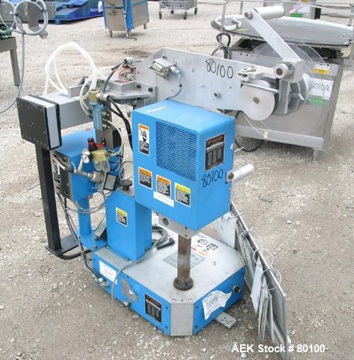 Used New Jersey Machine Co Colt "Easy Wrap" model 325-123 and 305L-459 table top semi-automatic labeler machine.