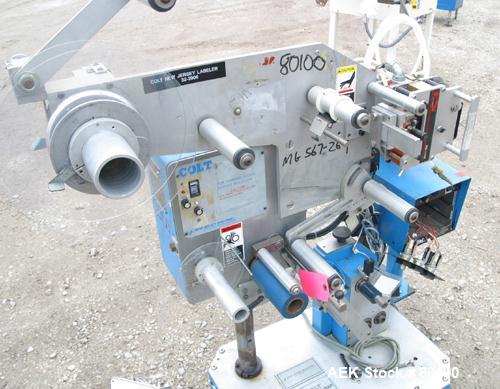 Used New Jersey Machine Co Colt "Easy Wrap" model 325-123 and 305L-459 table top semi-automatic labeler machine.