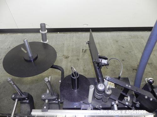Used Auto Labe Automatic Pressure Sensitive Wraparound Labeler, Model 110 RH APPLIER. Capable of speeds up to 100 bpm. Handles labels up to 4-1/2" high x *" long x 10" OD diameter roll core. Die cut ...