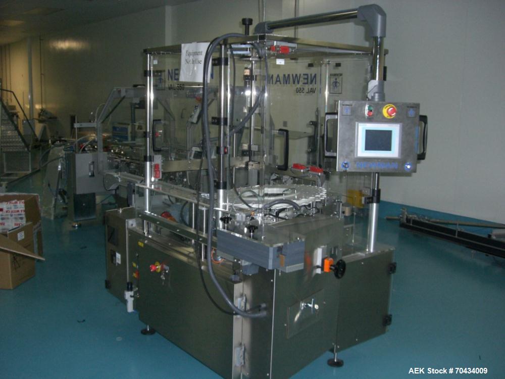 Used Newman Model VAL550 Labeller. Approximate maximum output 600 cpm. Includes PCE control system and in / out conveyors. Container size range: (Diameter) 8mm - 50mm. Label size range: (Height) 12mm...