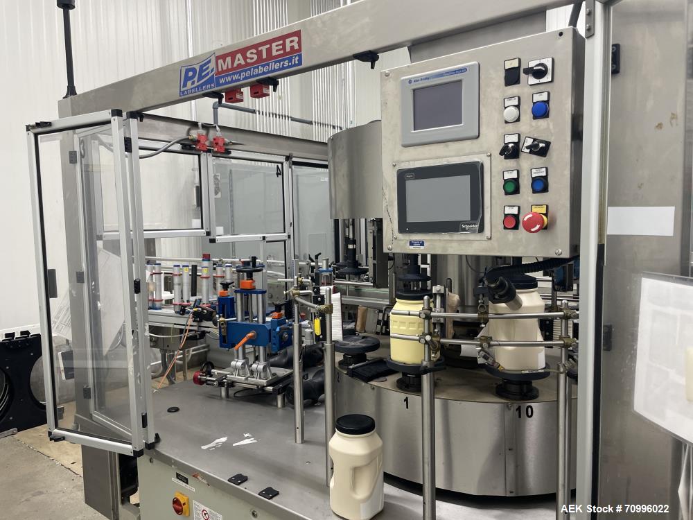 Used- P.E. Master Automatic Rotary Pressure Sensitive Labeler with Container Registration. Has redundant heads, capable of s...