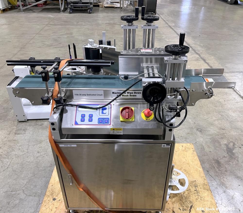 Used Pack Leader Model ELF-50 Wraparound Labeler. Maximum dispensing speed: 52.5'/minute, (16m/minute), 60 cont/minute. Maximum label size 4.75" x 11.8" (120mm x 300mm). Maximum container width: 6.3"...