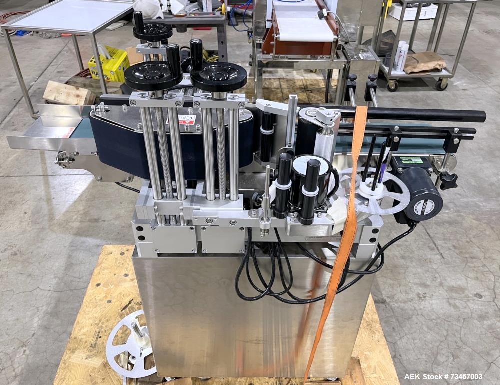 Used Pack Leader Model ELF-50 Wraparound Labeler. Maximum dispensing speed: 52.5'/minute, (16m/minute), 60 cont/minute. Maximum label size 4.75" x 11.8" (120mm x 300mm). Maximum container width: 6.3"...