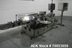 Used New Jersey wrap around labeler, model 334RSTP, speeds up to 400 units/minute, trunion roll bott...
