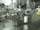 Used One (1) used Aesus wrap around labeler, model Premier Panel 362P, Herma label head, vision system, side bump belts, top hold down belt, reject and controls, 1/60/208 volt,