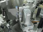Used One (1) used Aesus wrap around labeler, model Premier Panel 362P, Herma label head, vision system, side bump belts, top hold down belt, reject and controls, 1/60/208 volt,