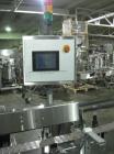 Used One (1) used Aesus wrap around labeler, model Premier Panel 362P, Herma label head, vision system, side bump belts, top hold down belt, reject and controls, 1/60/208 volt,