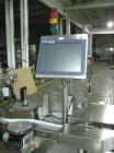 Used One (1) used Aesus wrap around labeler, model Premier Panel 362P, Herma label head, vision system, side bump belts, top hold down belt, reject and controls, 1/60/208 volt,