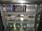 Used One (1) used Aesus wrap around labeler, model Premier Panel 362P, Herma label head, vision system, side bump belts, top hold down belt, reject and controls, 1/60/208 volt,
