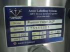 Used One (1) used Aesus wrap around labeler, model Premier Panel 362P, Herma label head, vision system, side bump belts, top hold down belt, reject and controls, 1/60/208 volt,