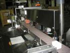 Used One (1) used Aesus wrap around labeler, model Premier Panel 362P, Herma label head, vision system, side bump belts, top hold down belt, reject and controls, 1/60/208 volt,