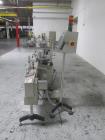 Used New Jersey Wrap Around Labeler, Model UNI300V-S007. Includes Optel vision system, model Optel OP300, 120 volt, serial# 15305-02, built 2004.