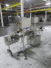 Used New Jersey Wrap Around Labeler, Model UNI300V-S007. Includes Optel vision system, model Optel OP300, 120 volt, serial# 15305-02, built 2004.