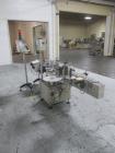 Used New Jersey Wrap Around Labeler, Model UNI300V-S007. Includes Optel vision system, model Optel OP300, 120 volt, serial# 15305-02, built 2004.