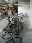 Used Used New Jersey wrap around labeler, model 334RSTP, speeds up to 400 units/minute, trunion roll bottle handling system, Open Date coder, model Printmaster R/H, size range of 1