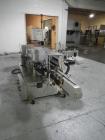 Used Used New Jersey wrap around labeler, model 334RSTP, speeds up to 400 units/minute, trunion roll bottle handling system, Open Date coder, model Printmaster R/H, size range of 1