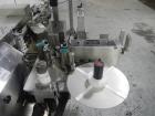 Used-Used New Jersey wrap around labeler, model 334RSTP, speeds up to 400 units/minute, trunion roll bottle handling system,...