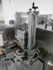 Used Used New Jersey wrap around labeler, model 334RSTP, speeds up to 400 units/minute, trunion roll bottle handling system, Open Date coder, model Printmaster R/H, size range of 1
