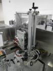 Used-Used New Jersey wrap around labeler, model 334RSTP, speeds up to 400 units/minute, trunion roll bottle handling system,...