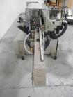 Used-Used New Jersey wrap around labeler, model 334RSTP, speeds up to 400 units/minute, trunion roll bottle handling system,...