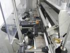 Used Used New Jersey wrap around labeler, model 334RSTP, speeds up to 400 units/minute, trunion roll bottle handling system, Open Date coder, model Printmaster R/H, size range of 1