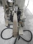 Used Used New Jersey wrap around labeler, model 334RSTP, speeds up to 400 units/minute, trunion roll bottle handling system, Open Date coder, model Printmaster R/H, size range of 1