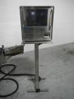 Used Used New Jersey wrap around labeler, model 334RSTP, speeds up to 400 units/minute, trunion roll bottle handling system, Open Date coder, model Printmaster R/H, size range of 1