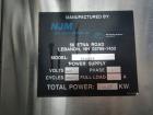 Used Used New Jersey wrap around labeler, model 334RSTP, speeds up to 400 units/minute, trunion roll bottle handling system, Open Date coder, model Printmaster R/H, size range of 1