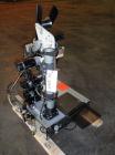 Used Avery 6101 Pressure Sensitive Spot or Wraparound Labeler, Model 6101-3-RH. Bench or tabletop labeler design, has hot stamp date coder, star wheel bottle indexing and 4