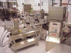 Used Kalish Labelstar Wraparound Pressure Sensitve Labeler, Model LS4000. Capable of speeds up to 150 cpm. Unit has Acuity PMC80 vision system, open date hot stamp coder bump wheel indexing, top hold...