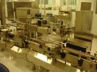 Used Kalish Labelstar Wraparound Pressure Sensitve Labeler, Model LS4000. Capable of speeds up to 150 cpm. Unit has Acuity PMC80 vision system, open date hot stamp coder bump wheel indexing, top hold...