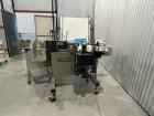 Label Aire pressure sensitive wraparound labeler.