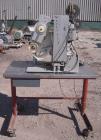 Used Labeling Systems Inc (LSI) Semi Automatic Wrap Around Labeler, Model 301S. Designed for semi automatic wrap around labeling of products such as bottles, vials or cans. Maximum bottle size 12